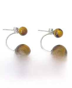 Macro detail of S925 silver double tiger eye bead earrings with vintage style