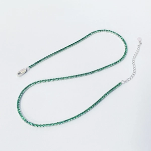 Detailed macro view of S925 sterling silver tennis necklace with green zircon stones