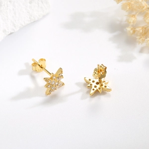 Detail shot of gold S925 silver star earrings with pave-set cubic zirconia accents