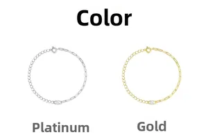 Detail of minimalist S925 silver bracelets in gold and silver finish with round gemstone