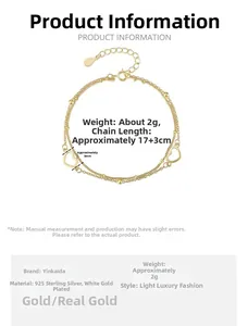 Detail view of 925 sterling silver gold-plated double-layer bracelet with heart pendants