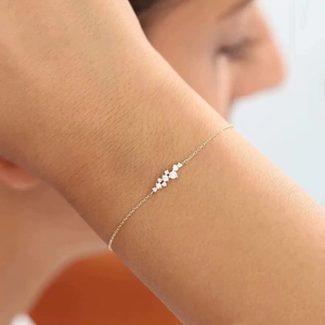 Minimalist S925 sterling silver gold bracelet with clustered cubic zirconia on wrist
