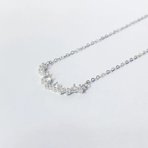 Elegant S925 silver smile necklace featuring curved row of graduated white zircons