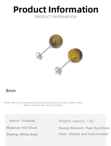 Macro view of 8mm tiger eye stone stud earrings set in 925 silver with white gold plating