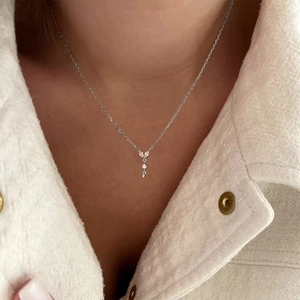 Elegant S925 silver marquise zircon butterfly necklace shown on model with tweed jacket