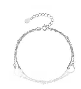 Detail of s925 silver double-layer bracelet featuring hollow heart charms and lobster clasp