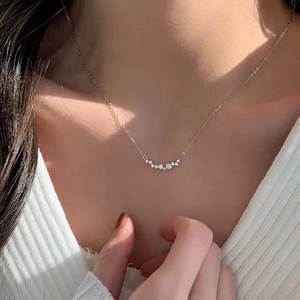 Elegant S925 sterling silver smiling curve necklace with sparkling zircon on a model