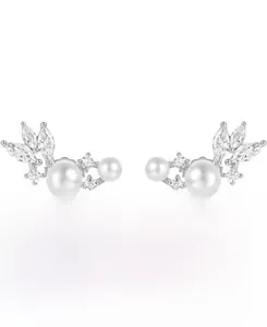 Macro detail of S925 silver feather earrings with white pearls and zircon stones
