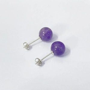 Detailed close-up of S925 sterling silver hallmark and purple amethyst stone earring