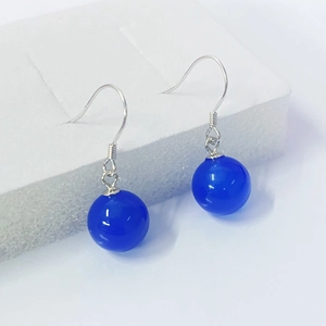 S925 sterling silver drop earrings with blue agate beads on a white minimalist background