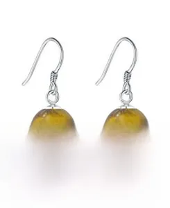 Macro detail of natural tiger eye beads and S925 sterling silver earring hooks