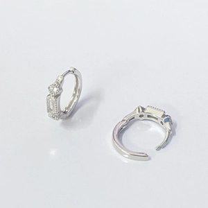 Detail of S925 sterling silver hoop earrings with rectangular zircon and hinge structure