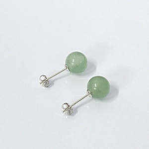 Macro detail of natural aventurine jade earrings with 925 sterling silver hallmarks