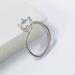 Macro detail showing S925 hallmark on silver ring with snowflake prong set cubic zirconia
