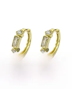 Detailed close-up of gold-plated S925 silver hoop earrings with clear zircon stones