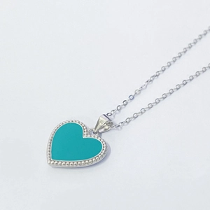 Minimalist S925 silver heart necklace with turquoise enamel pendant on white background