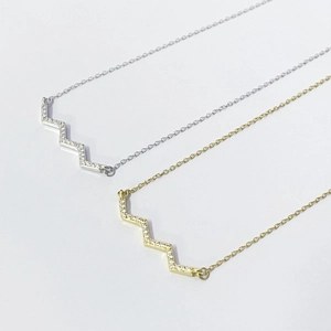 Elegant S925 silver wave pendant necklace with sparkling diamonds in gold and silver finish
