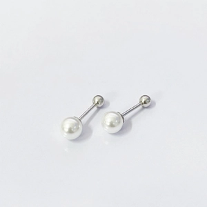 Detailed view of S925 silver pearl stud earrings with screw back design and minimal style