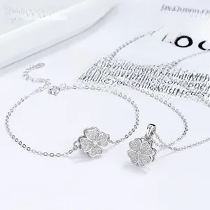 Detailed view of S925 silver clover necklace and bracelet set with sparkling zircon stones