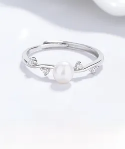 Detail of 925 silver adjustable ring with white freshwater pearl and cubic zirconia