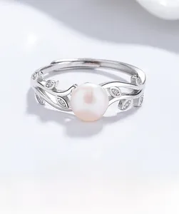 Macro view of a 925 silver leaf ring featuring a freshwater pearl and cubic zirconia