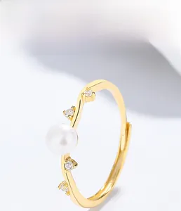 Macro shot of 925 silver ring featuring a freshwater pearl and sparkling cubic zirconia
