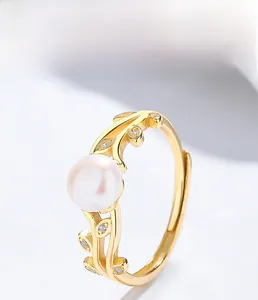 Macro shot of 925 silver leaf ring featuring freshwater pearl and zircon details