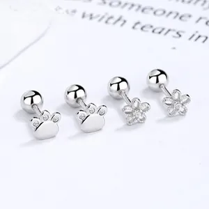 Macro view of 925 sterling silver cat claw and flower stud earrings with zircon inlay