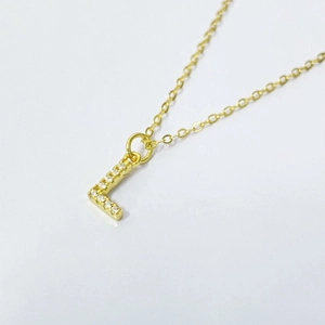 Elegant gold S925 silver necklace with letter L pendant and shimmering zircon pavé stones
