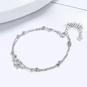 Detailed close-up of S925 sterling silver double star bracelet with zircon inlay