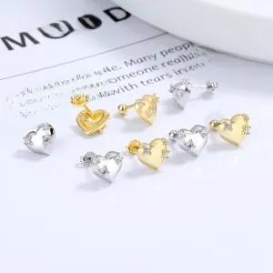 Detailed view of 925 silver heart stud earrings with black enamel and zircon inlay
