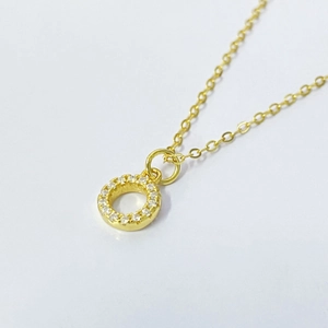 Elegant gold S925 silver necklace featuring a sparkling zircon paved circle pendant