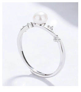 Macro shot of 925 sterling silver ring with white freshwater pearl and zircon detail