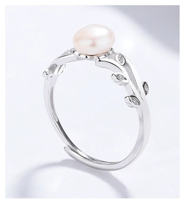 Detailed macro view of S925 silver leaf ring with pink freshwater pearl and zircons