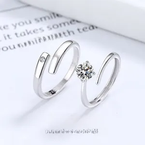 Macro shot of 925 sterling silver couple rings showing S925 hallmark and adjustable band