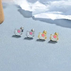 Detail of 925 silver cat screw back earrings with pink star motif in gold and silver