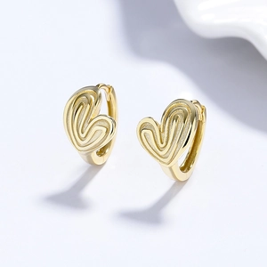 Textured gold heart-shaped hoop earrings with spiral relief design for a modern look