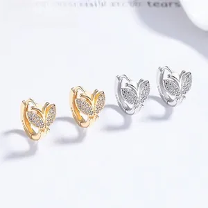 Detailed close-up of 925 sterling silver butterfly earrings with sparkling cubic zirconia