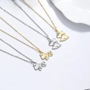 Macro view of five hollow bear pendants in gold and silver finish on O-chains