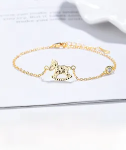 Macro detail of S925 sterling silver rocking horse pendant with crushed ice texture on a chain