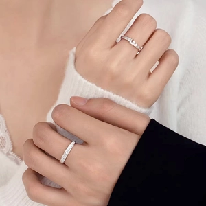 925 silver moon and star couple rings with zircon inlays worn by a hand-holding couple
