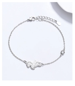 Macro view of 925 silver horse bracelet with winged pendant and sparkling zircon