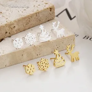 Macro view of 925 silver Christmas earrings set featuring snowflake and reindeer designs