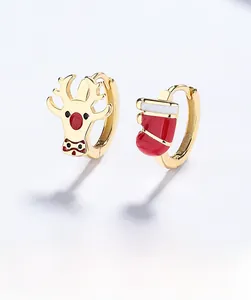Detail of 925 silver reindeer and Christmas stocking earrings with red enamel