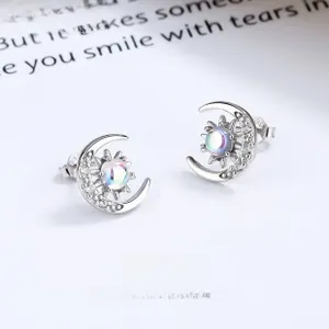 Detailed macro shot of 925 silver moonstone earring with sun and crescent moon motif