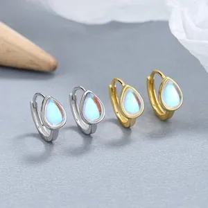 Detail of drop-shaped moonstone earrings in gold and silver finish with S925 silver studs