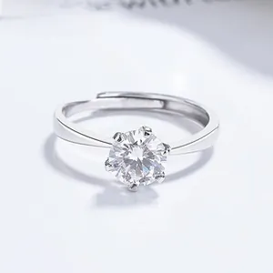 Close-up of a 925 sterling silver moissanite ring with a classic six-prong setting