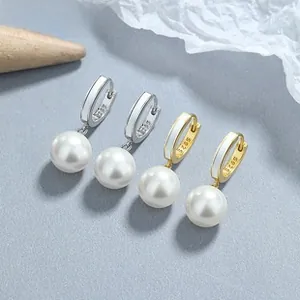 Detailed view of S925 sterling silver hoop earrings with white enamel and round pearls