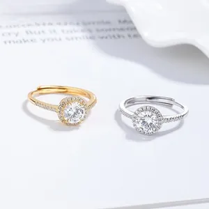Macro detail of adjustable 925 silver rings with oval zircon and pavé setting