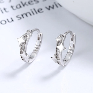 Detailed view of S925 sterling silver star earrings with sparkling cubic zirconia inlay